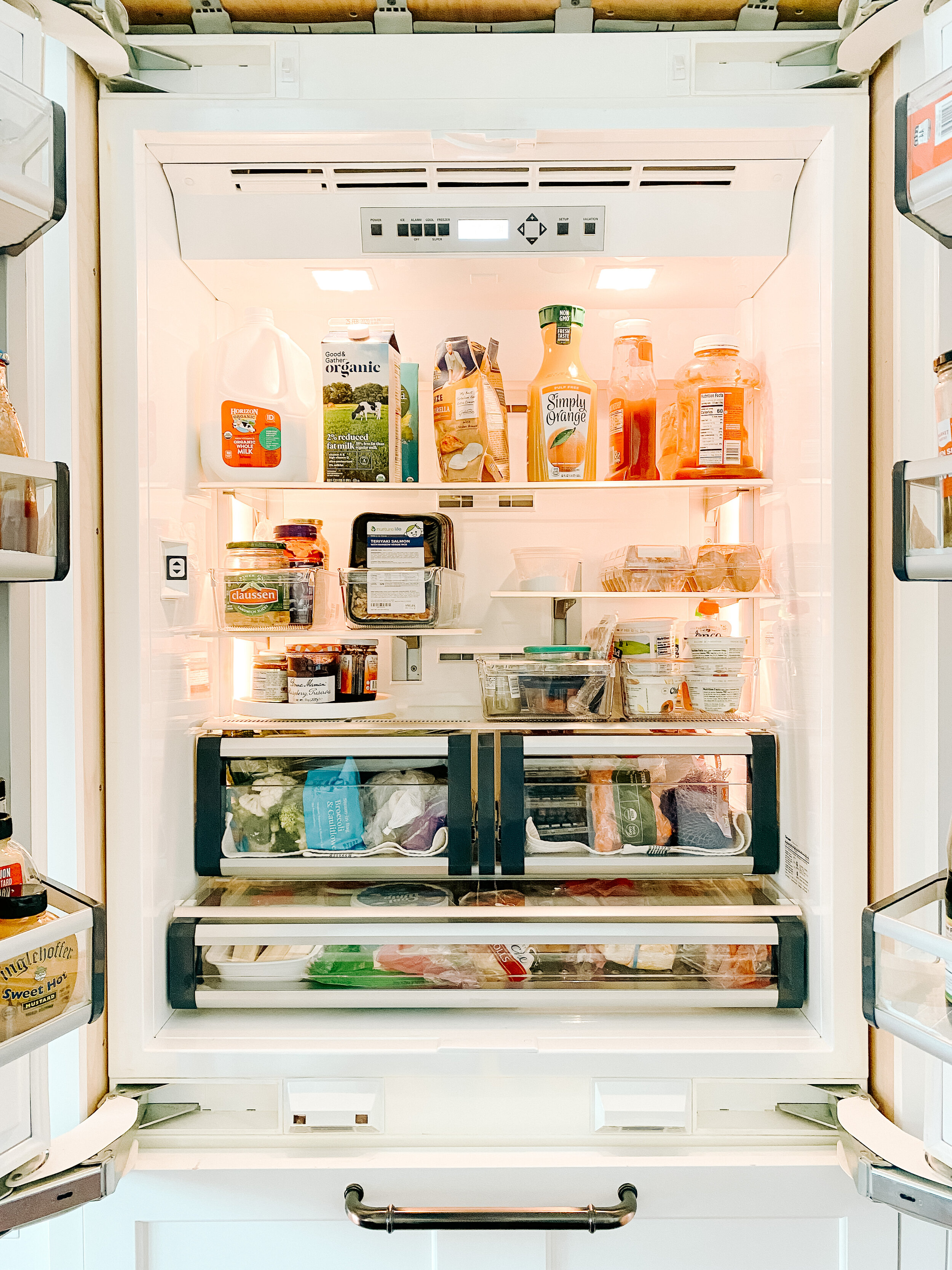 Our refrigerator AFTER the clean out! Click here for all the sources to help you tackle deep cleaning &amp; organizing your fridge.