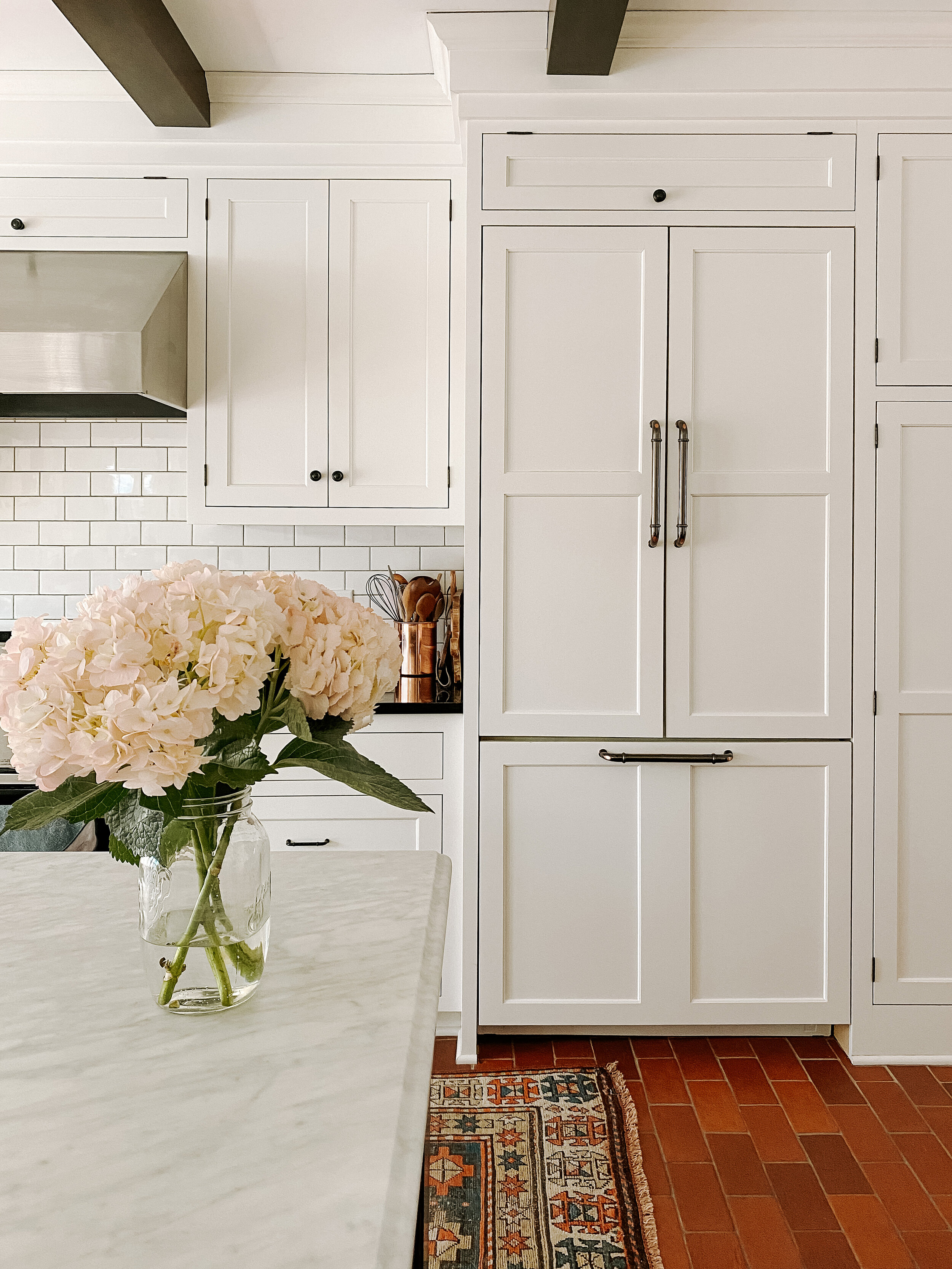 Fridge is Thermador. It was a floor model and purchased from Craigslist. Check out my Kitchen page for more sources.