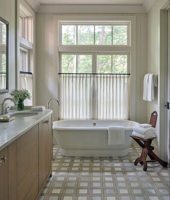cafe curtains in bathroom with freestanding tub