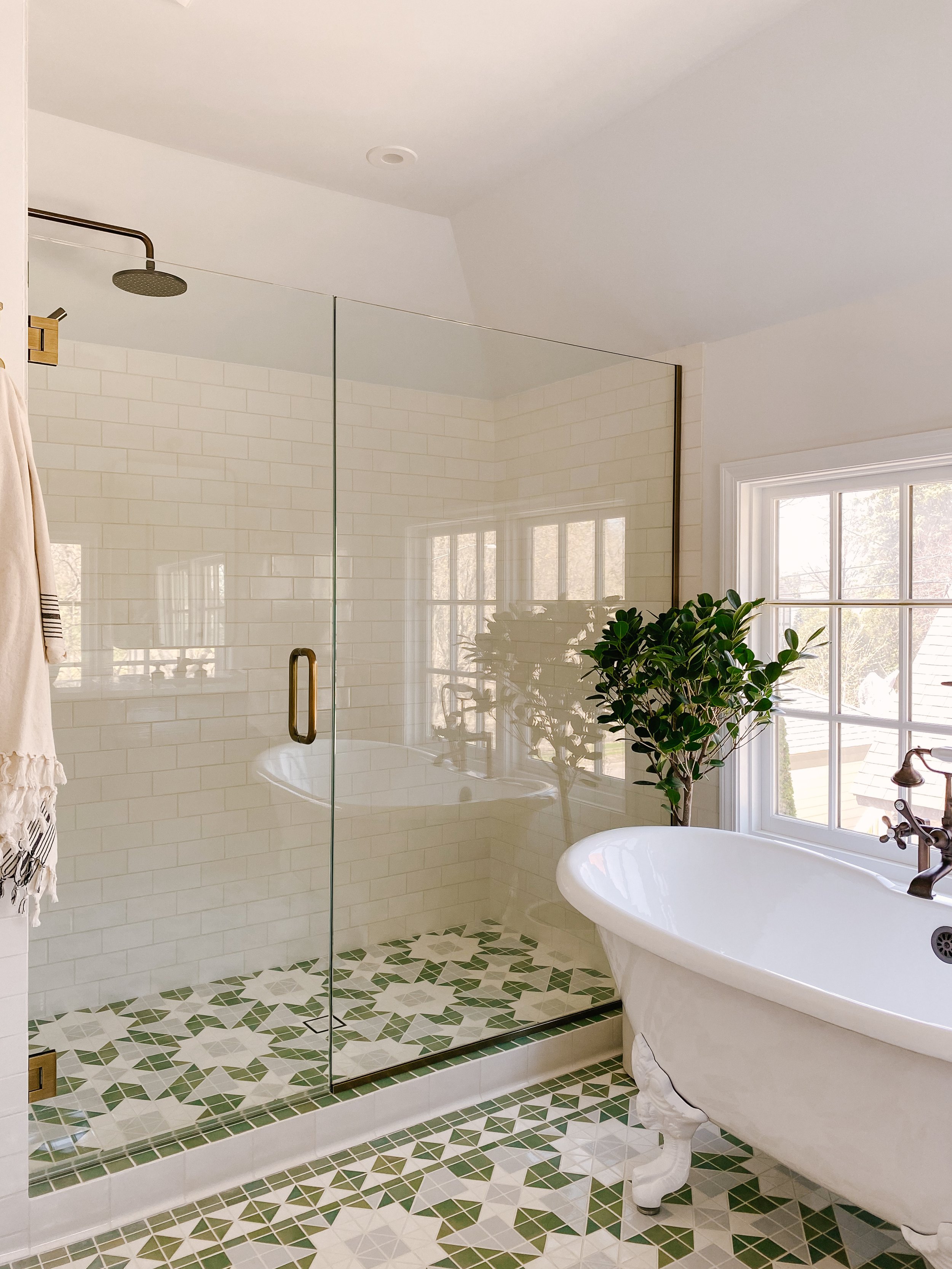 Glass Shower with green tiling in Patti Wagner's home