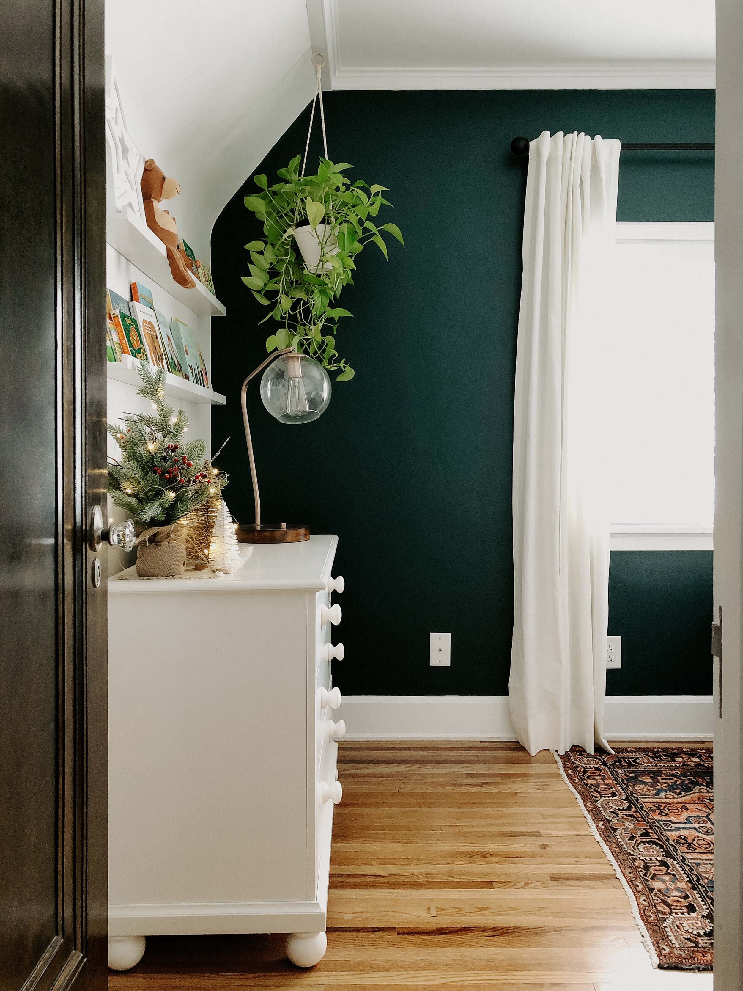 Dresser | Vintage Rug | Hanging Planter | Curtains | Curtain Rod | “Night Watch” Paint color from Home Depot | Picture Ledge