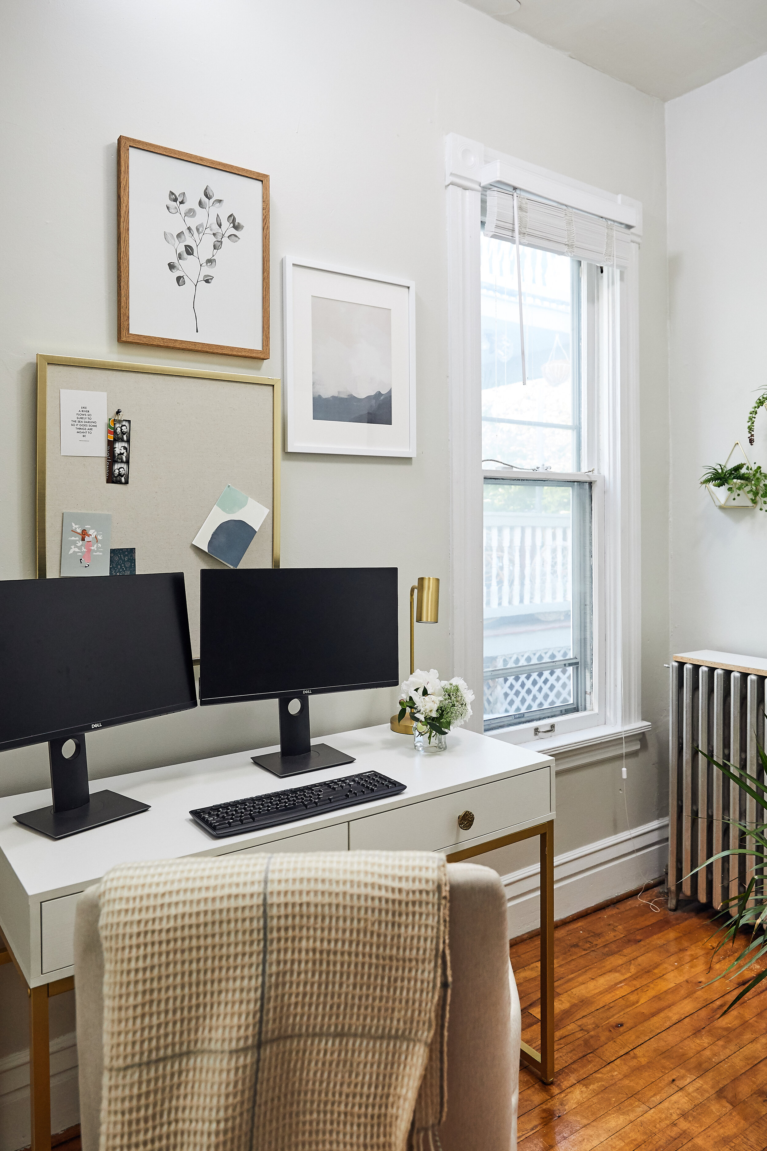 Source: desk lamp; geometric wall hanger; white matted frame; gold &amp; linen pin board