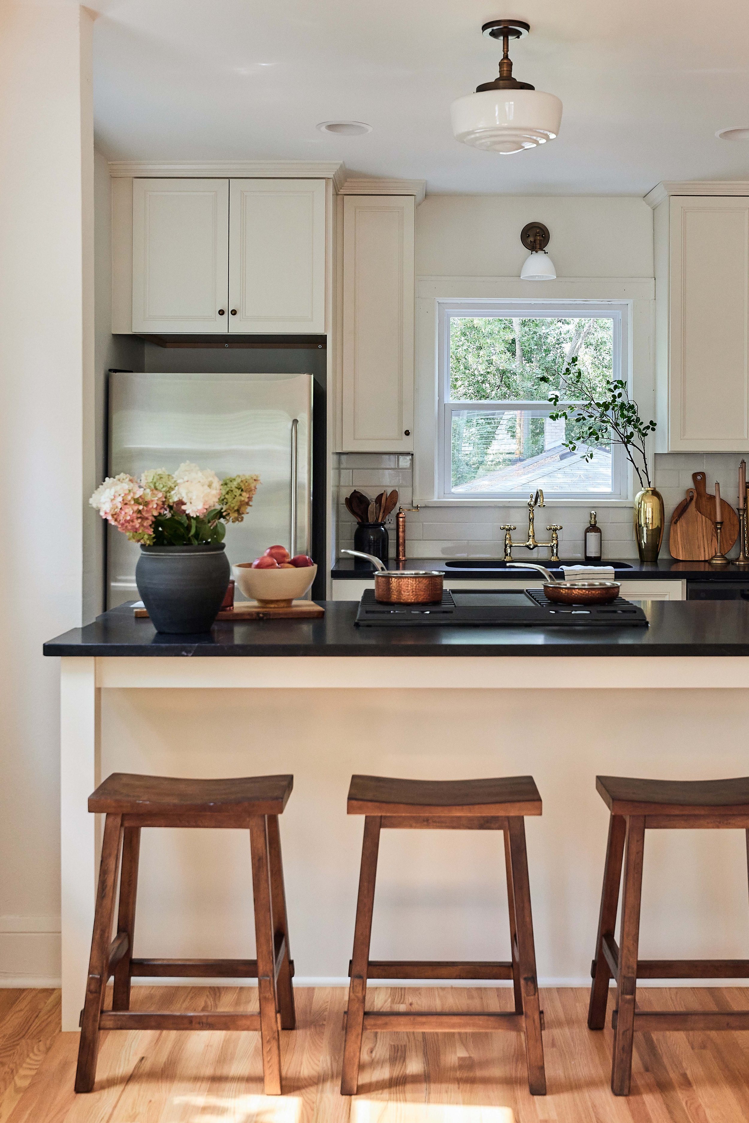 Our stucco farmhouse rental property renovation - kitchen layout & design reveal; cream cabinet with honed black granite kitchen